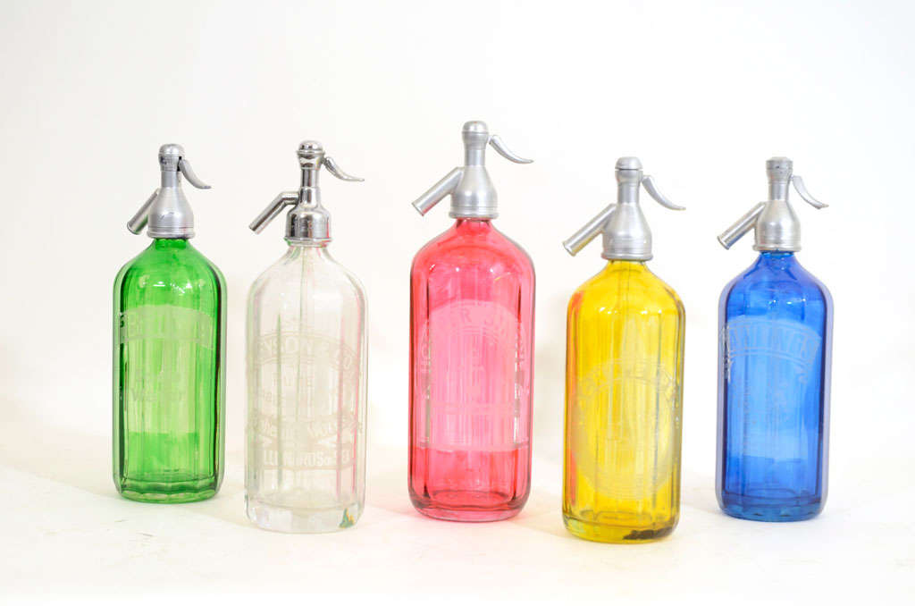 Collection of Five Vintage Glass Soda Bottles in Green, Clear, Red, Yellow, and Blue; Each Bottle Etched with a Different Company Name including, 