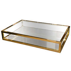 An elegant polished brass two-tiers coffee table . france 1970