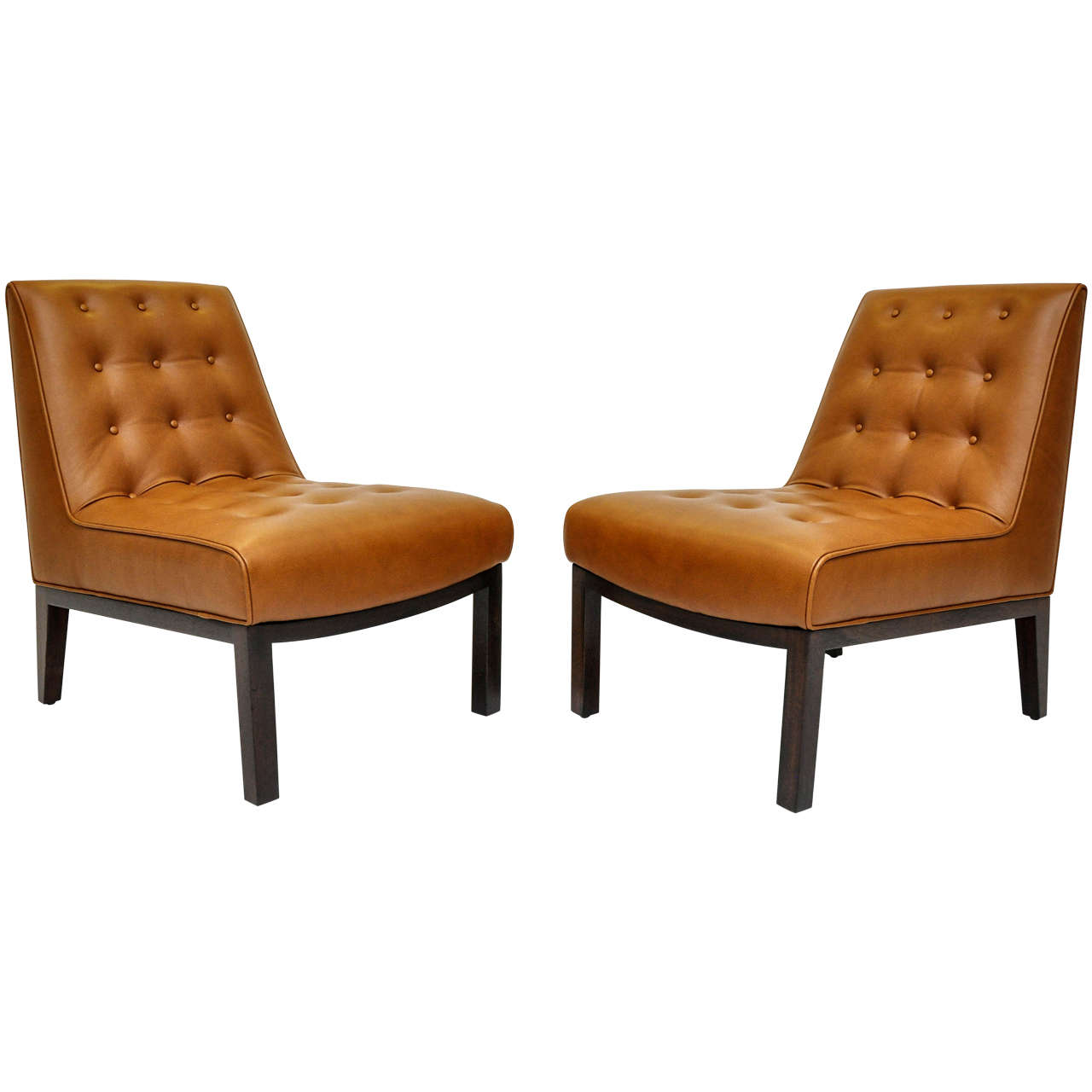 Slipper chairs designed by Edward Wormley for Dunbar, circa 1950s. Newly upholstered in cigar leather over refinished bases. Fully restored.