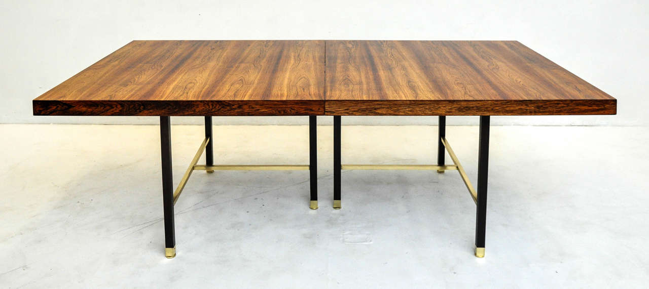 Rosewood top dining table with mahogany and brass frame. Designed by Harvey Probber, circa 1960s. Fully restored and refinished. Two 16