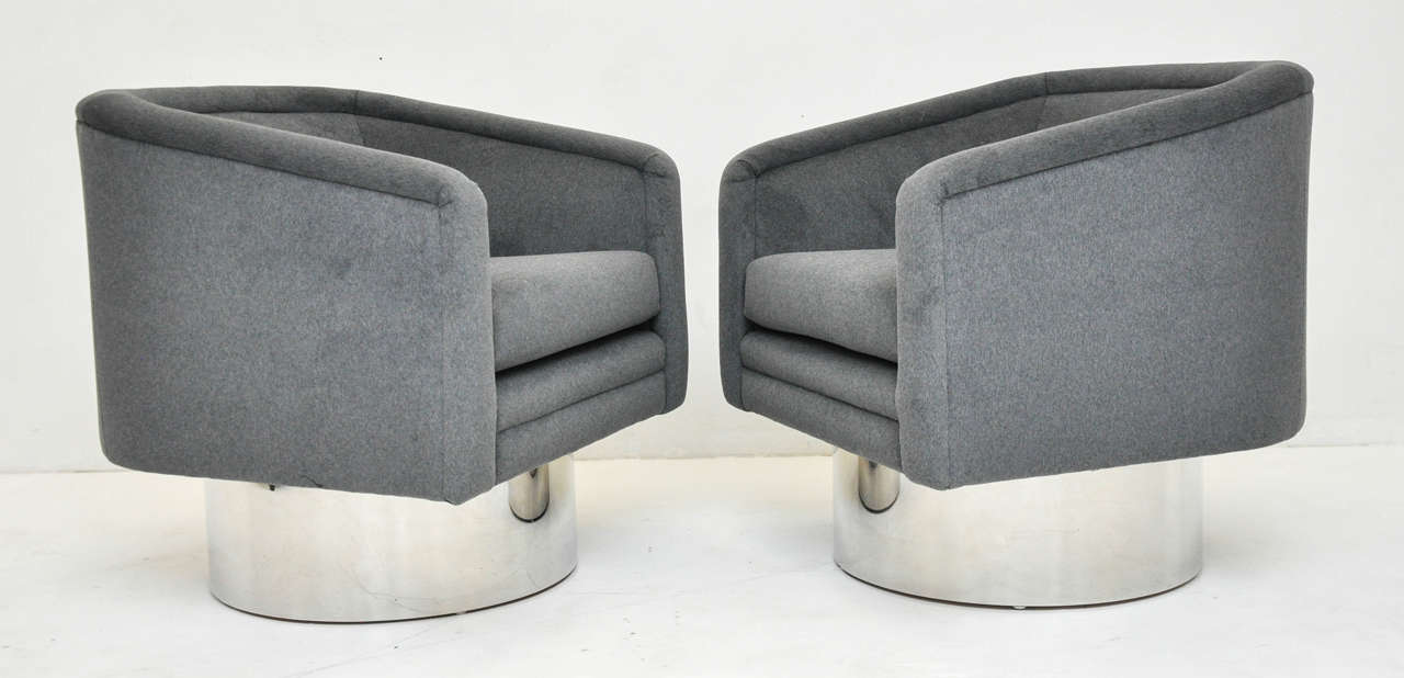 Swivel chairs by Leon Rosen for Pace Collection. Heavy stainless steel swivel bases. Newly upholstered in cotton velvet.