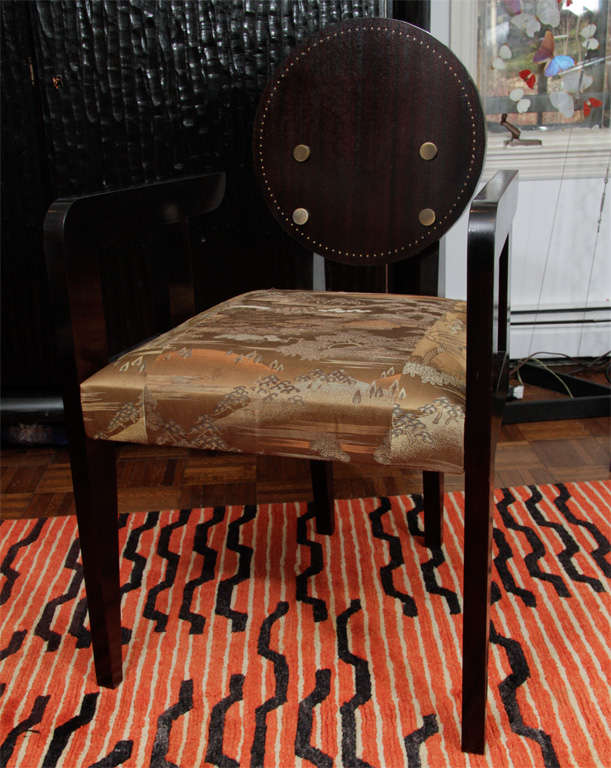 A fine armchair in the manner Andre Sornay with nailhead details and four disc decorations on the back splat, upholstered in a vintage Japanese obi.