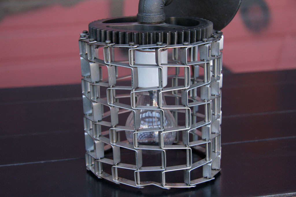 SCONCE (UP TO 100 WATTS) DESIGNED WITH RECLAIMED INDUSTRIAL FITTINGS AND CONVEYOR BELT