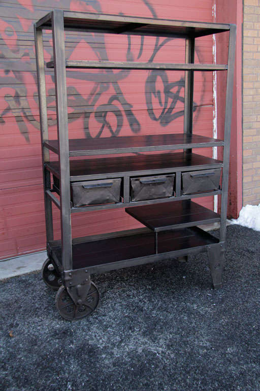 OPEN SHELVING/CABINET ON WHEELS DESIGNED WITH RECLAIMED STEEL AND VINTAGE STORAGE BINS
