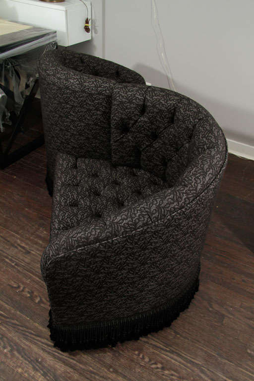 Serpentine sofa with wool lace overlay that allows two people to talk.