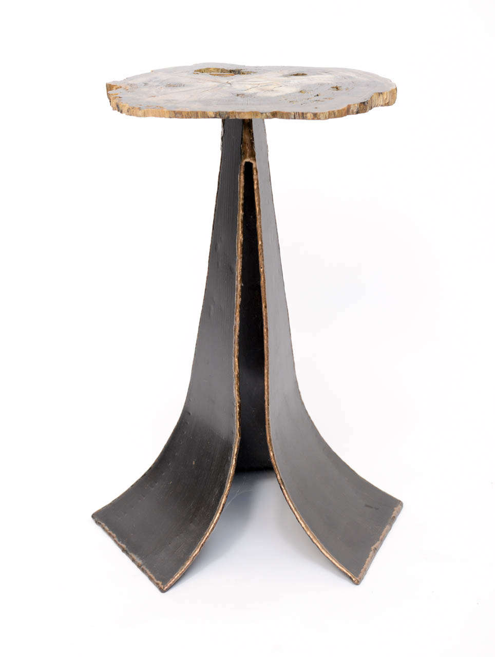 Petrified cedar top table on iron base. Perfect as an accent in the Brutal style.
