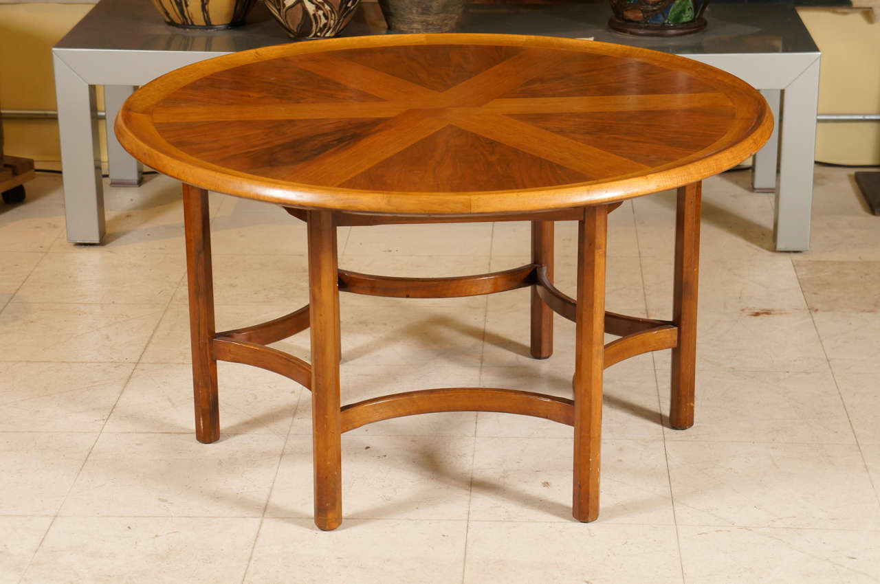 Circular coffee table in mahogany with crossbanding on six legs with hexagonal stretchers by a Danish cabinet maker, Mid-Century Modern.