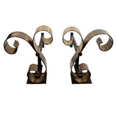 Pair of Stylized Scrolled Bronze Andirons Attributed to Raymond Subes