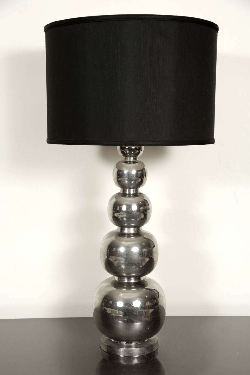 Impressive pair of table lamps in silvered metal.