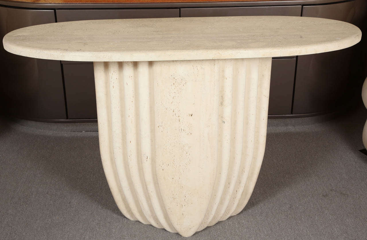 Beautiful travertine console with an oval top.