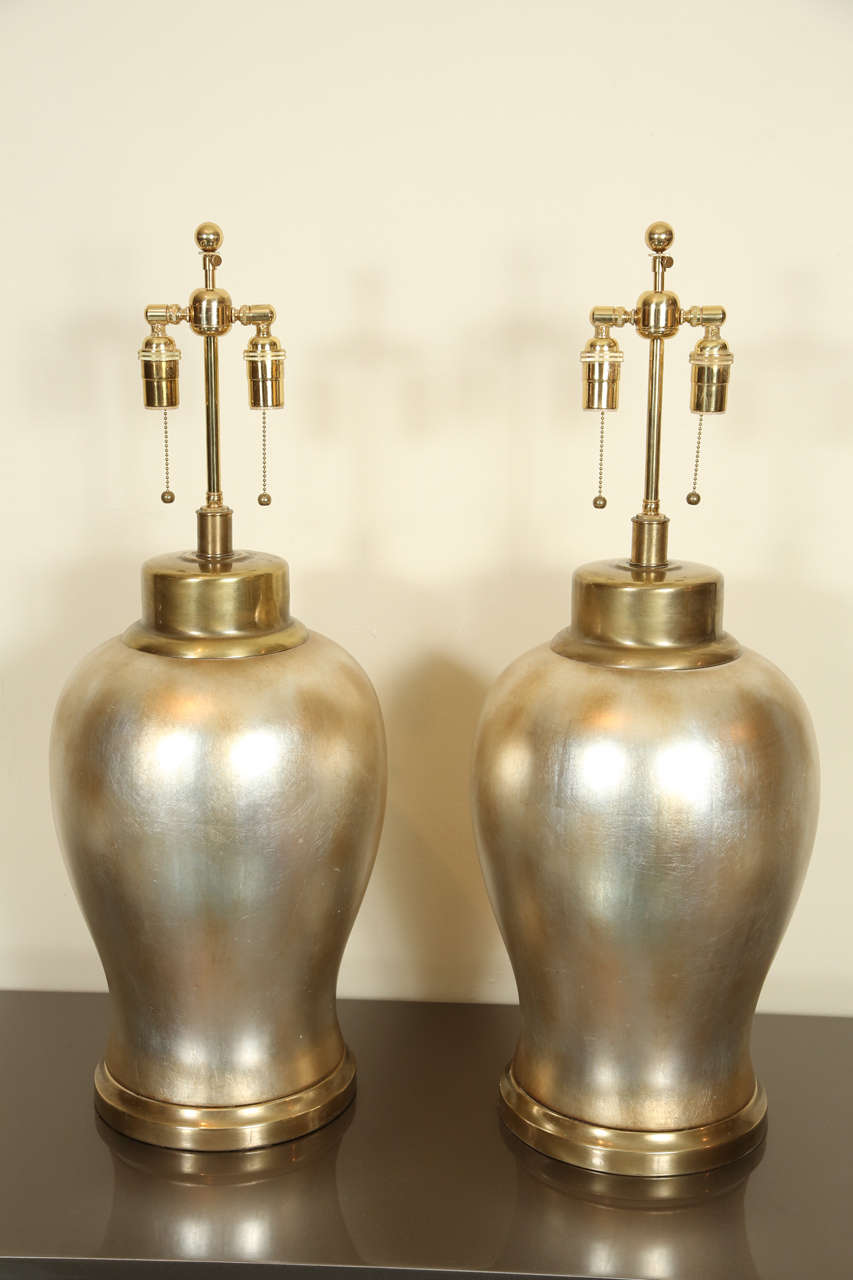 Spectacular Pair Of Ceramic Urn Lamps With A Silver Leaf Finish.