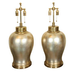 Spectacular Pair Of Ceramic Urn Lamps With A Silver Leaf Finish.