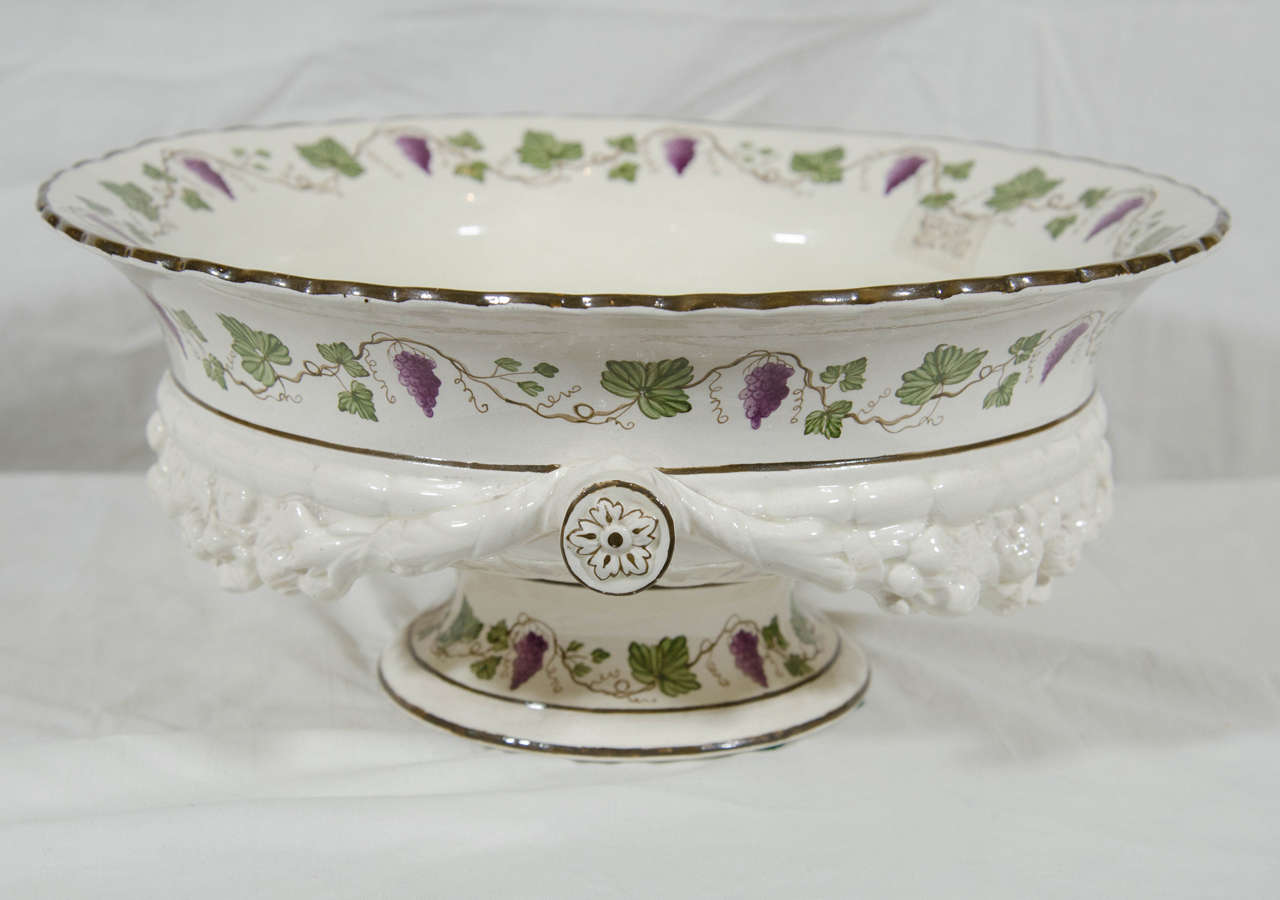 A large Wedgwood Creamware bowl decorated inside and out with a border of purple grapes and green grape leaves on the vine. 
The bottom of the bowl with painted Wedgwood marks see images # 8 and 9.