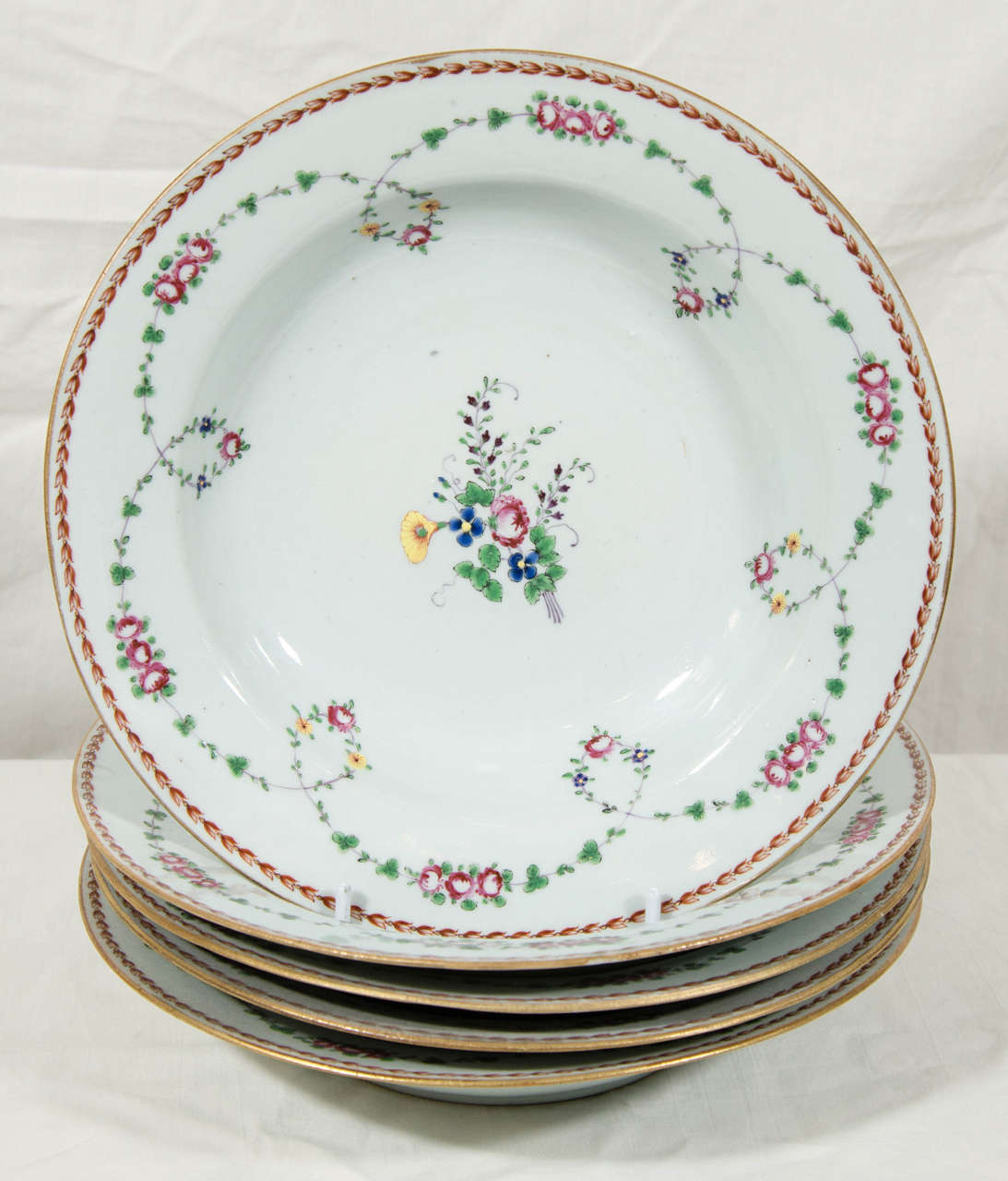 Provenance: With paper stickers for the eminent dealer of Chinese porcelains Elinor Gordon. Decorated in the 18th century French taste with a delicate sprig of peonies and cornflowers encircled by swags with pink peonies and green leaves.
