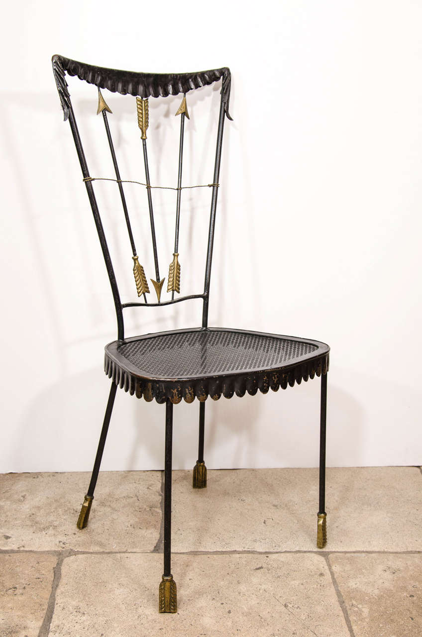 A set of four Mid-Century arrow-back iron and brass Tomaso Buzzi bistro chairs, Italy, circa 1940.