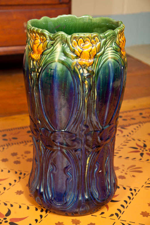 This is a really pretty and vibrant Majolica Water Lily pattern umbrella holder stand. This piece will definitely add character to your home’s interior. Majolica is a type of soft earthenware ceramic formed with plaster of paris molds, and many