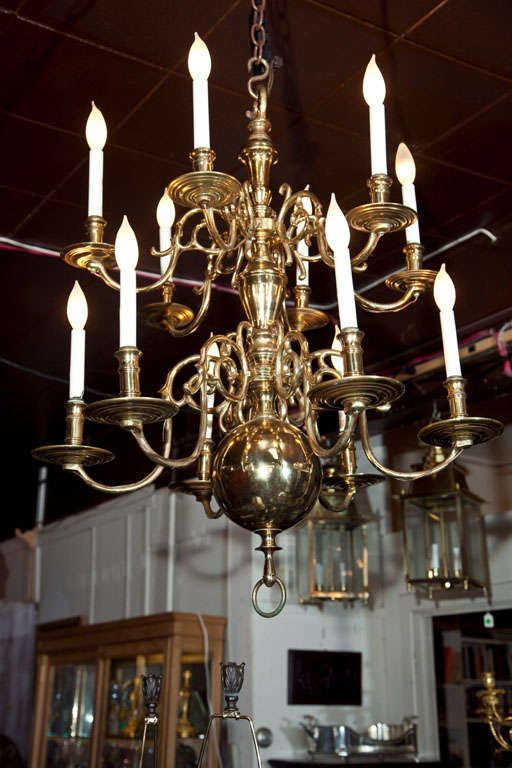10 Light Chandelier in the Dutch style, with 5 arms below and  5 arms above. Made of heavy brass with solid arms, wiring on the outside of the arms.  Large sold brass ring finials.