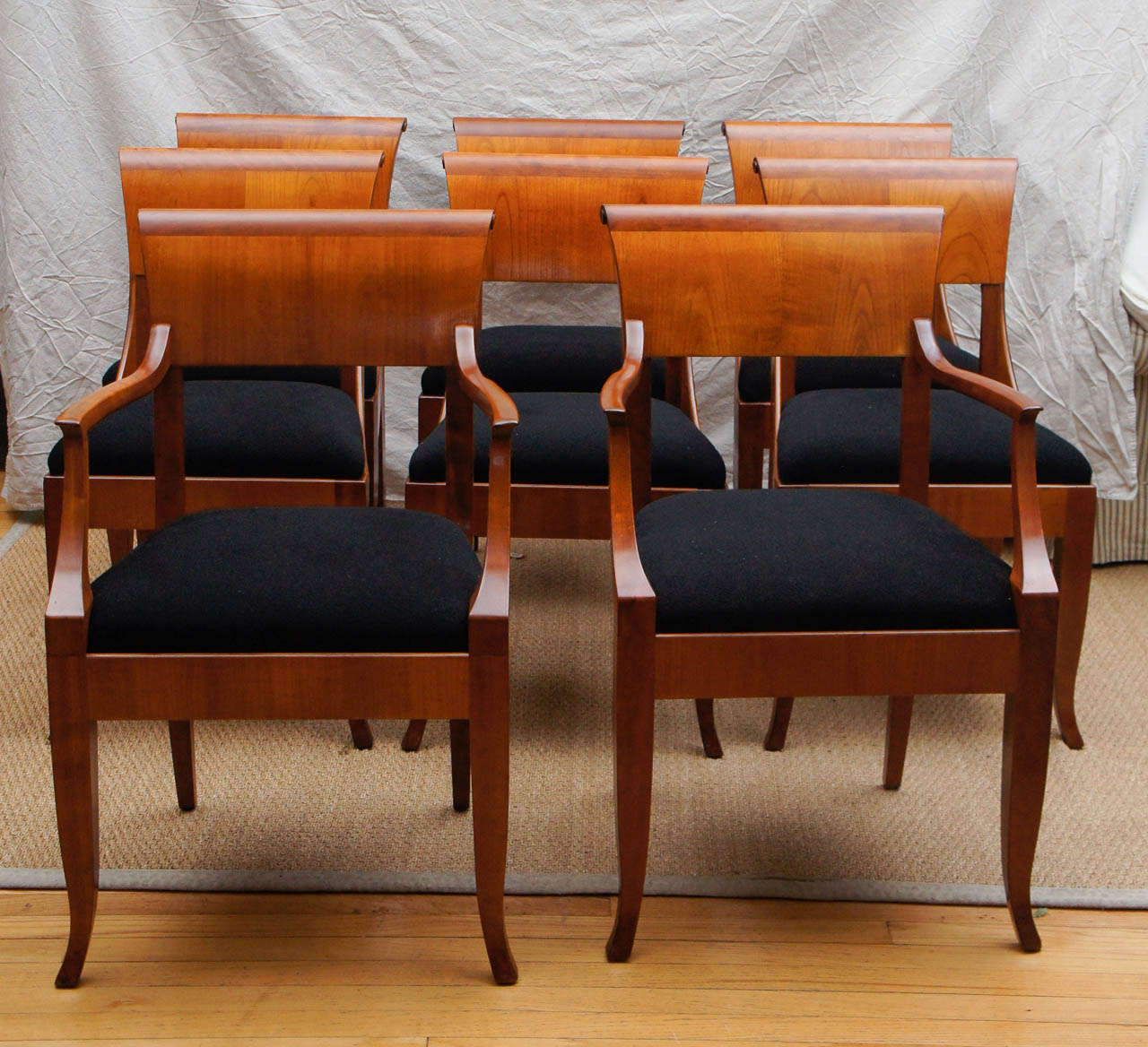 Set of eight Neoclassical dining chairs. Six sides, two arms. Italian fruitwood.

Dimensions:
33.75