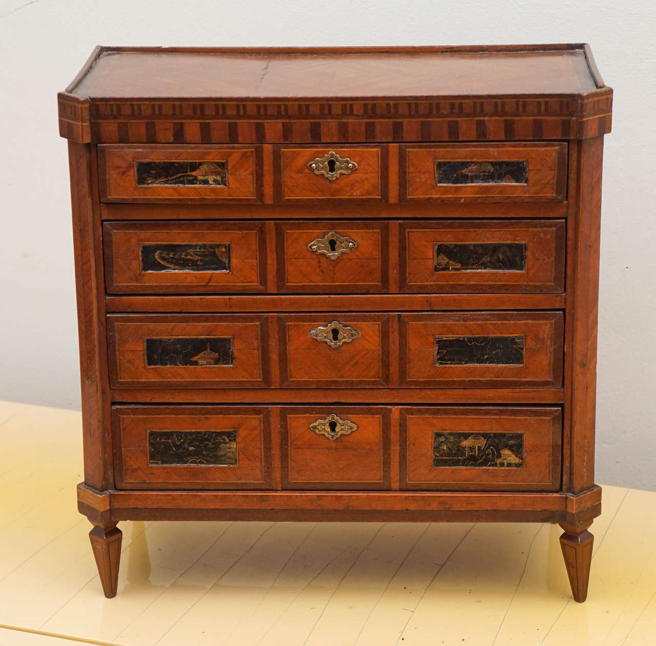 This superb miniature chest has intricate marquetry and 