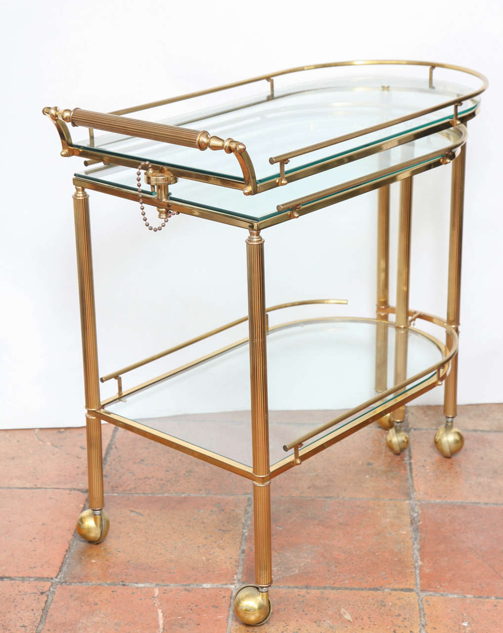 A useful articulated serving cart that can be used for many different occasions. The lower half can be unattached and swing out from the top to allow for more serving space. Lower space: 25.5
