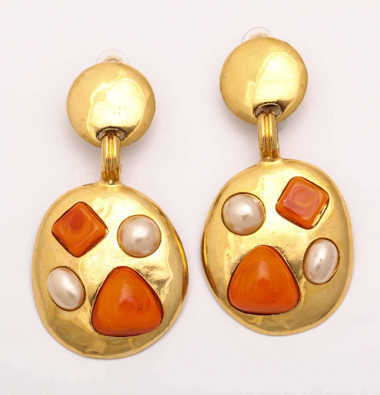 A great pair of faux pearl and coral earrings by Chanel.