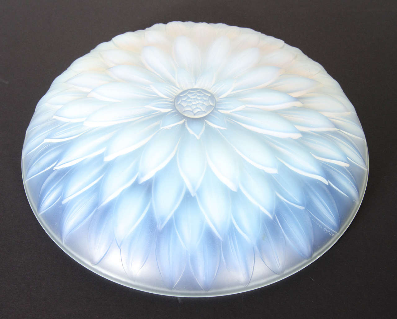 This gorgeous bowl features an features a stylized Art Deco floral design in relief frosted iridescent glass. It is also is signed Etling, France on the bowl as well.