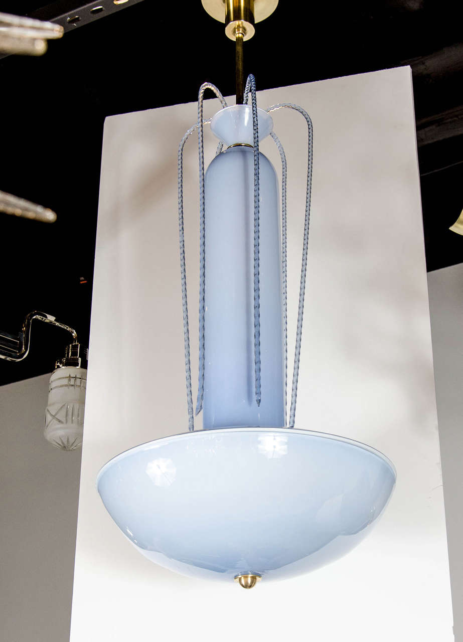 Mid-Century Modern hand blown blue Murano glass 'Fountain' chandelier with brass fittings, circa 1940. The exquisite 'Fountain' chandelier consists of a bottom dome that is comprised of one hand blown Blue Murano glass bowl and then topped with a