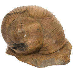 A modern carved wooden snail.