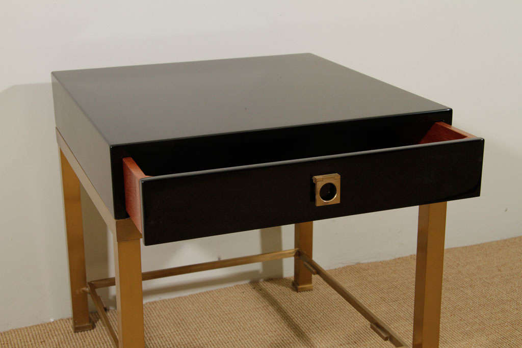 Mid-20th Century A Pair of Maison Jansen Black Lacquer and Brass End Tables.