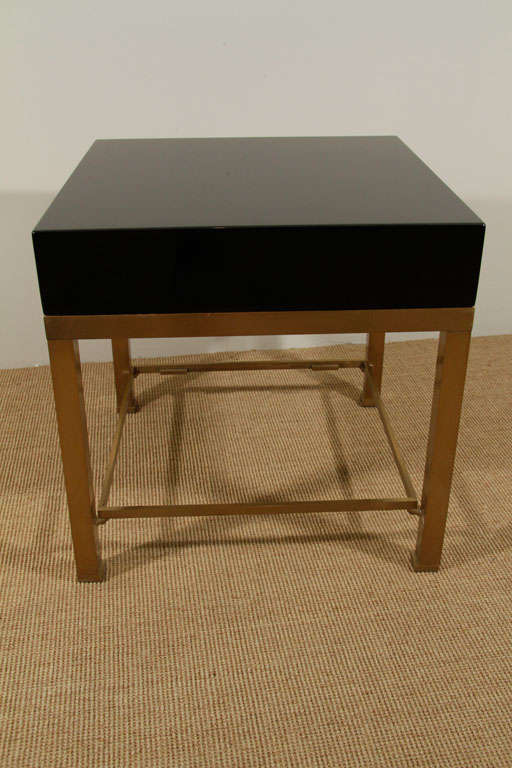 A Pair of Maison Jansen Black Lacquer and Brass End Tables. 2