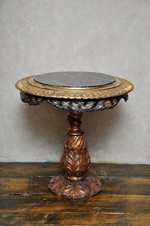 Rare hand carved polychromed-painted and parcel gilt Venetian center table.  The frieze with carved draperies, supported on a carved pedestal base adorned with acanthus leaves.