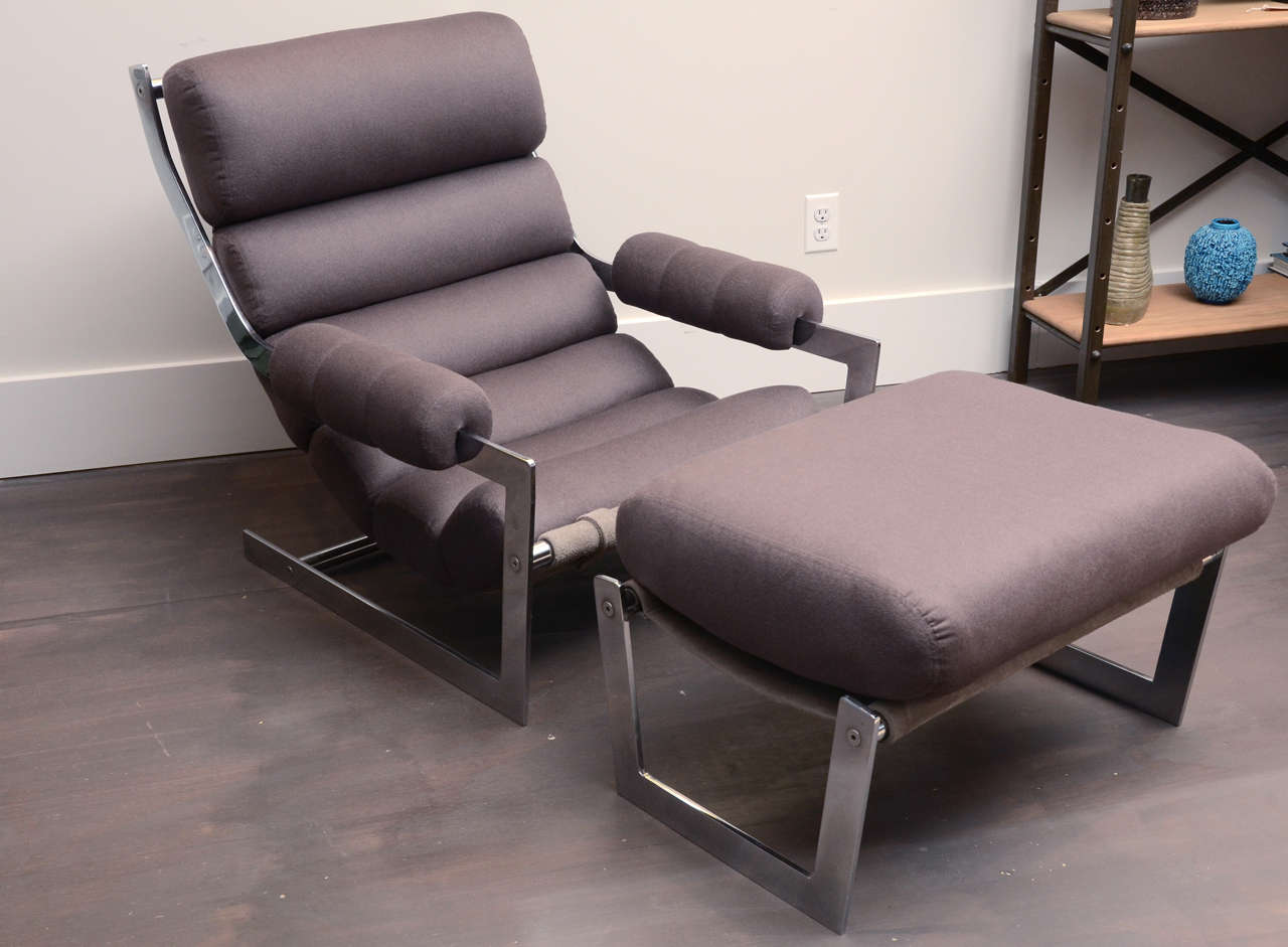 Chic modernist sling chair and ottoman set. 

Sleek flat bar chrome frame, grey suede sling, channeled seat cushion, and brand new upholstery in a luxurious chocolate brown cashmere. 

Ottoman dimensions: 25