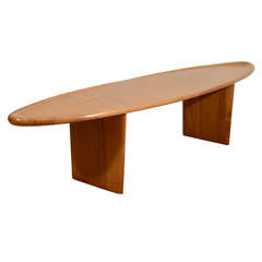 A Robsjohn-Gibbings Walnut Surfboard Table.