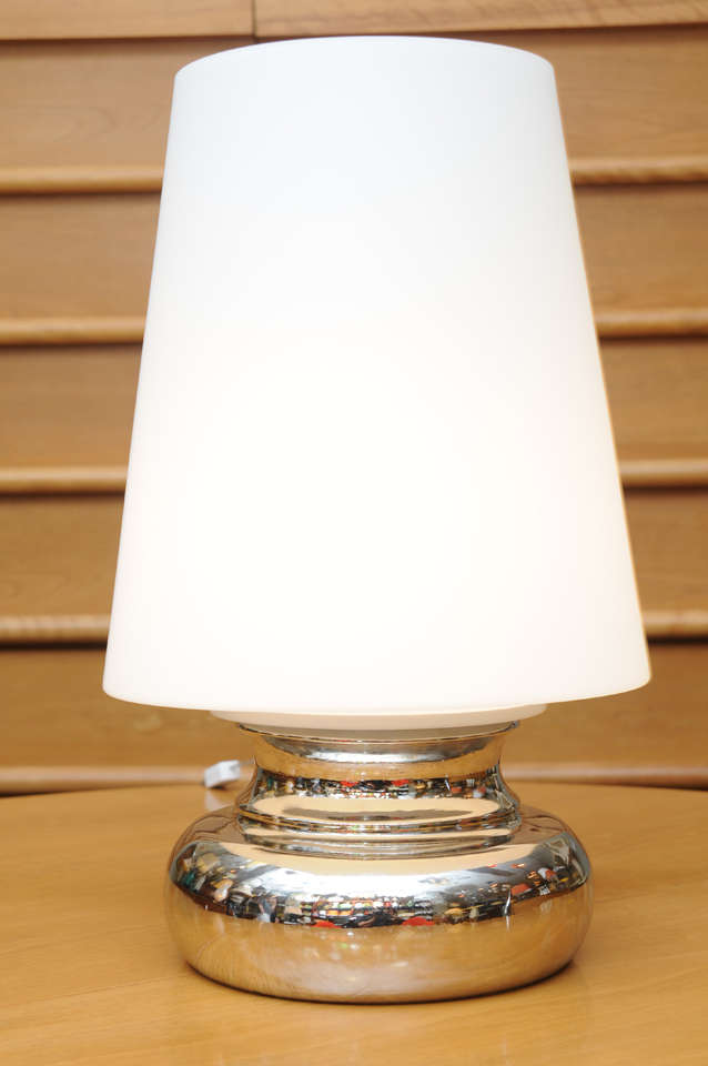 With its oversized satin glass shade and bublous nickel silver base, this modernist Italian lamp from Laurel lamps is op to pop yet serious in design. The stylized chimney shape tapering cased satin glass shade is large and impressive. The nickeled