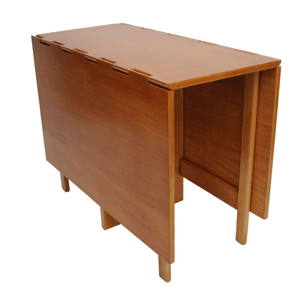 SOLD  Extremely versatile, this drop-leaf table by George Nelson and produced by Herman Miller in the 1950s can beautifully serve many purposes.  As a slim console table....with one leaf up, a work table, desk or three seater dining table and with