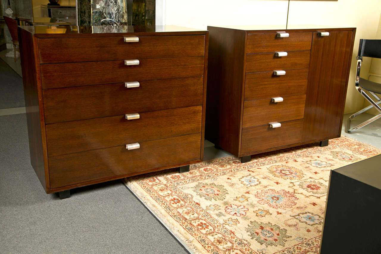 Pair of exceptional thin edge chests of drawers by George Nelson for Herman Miller, in impeccable condition. One has a set of graduating drawers, the other has drawers and a cabinet. Both have nickel polished pulls; raised on block feet. Both chests