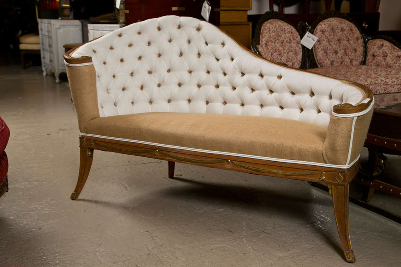 An attractive French canape / recamier, circa 1930s, the shaped back with tufted upholstery, scrolled arms, padded seat upholstered in burlap, raised on splayed legs.  Manner of Grosfeld House
