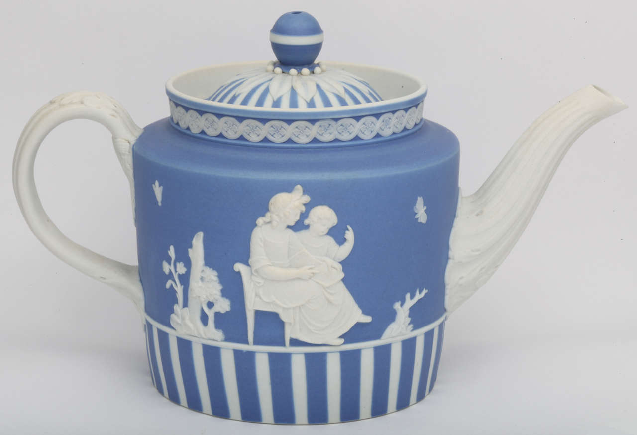 A rare Wedgwood white on blue dip jasper teapot decorated with Lady Templetown motifs, uopper case mark
