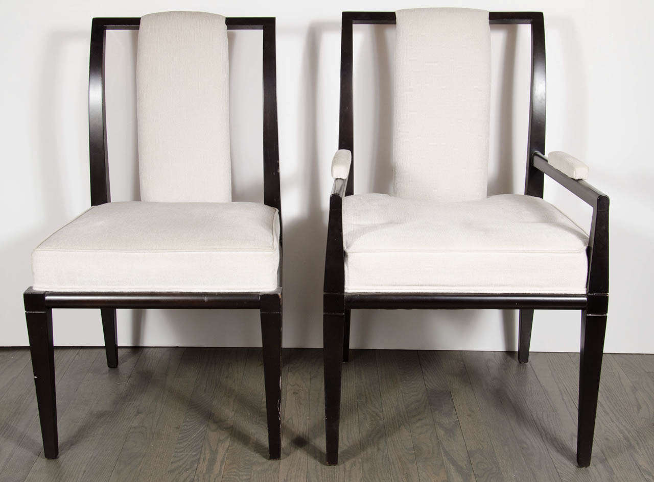 This gorgeous set of eight chairs feature two arm and six side chairs.They are made of ebonized walnut and have been newly reupholstered in a creme textured fabric.They also have a ultra chic tapered leg design.
Arm Chair 21 W x 23 D x 35 H,19 seat