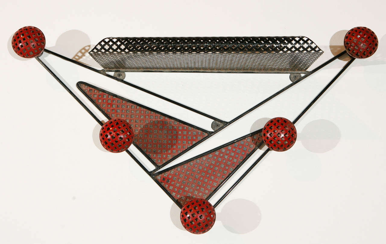 Mathieu Mategot perforated iron hat rack painted in red an black