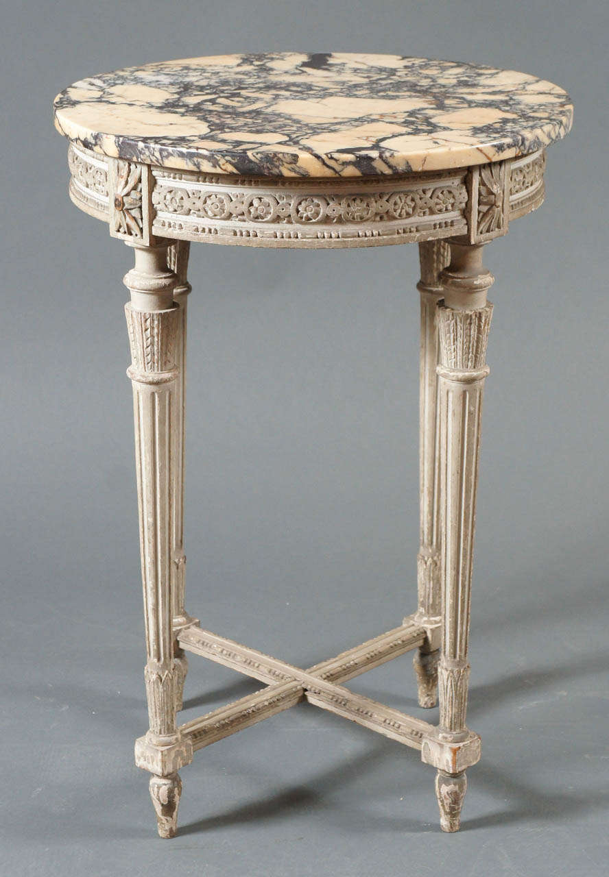 Single French side table with marble top with veining.