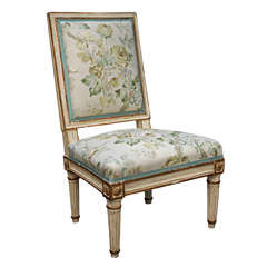 A  Louis XVI Painted and Gilded Chaffeuse Chair