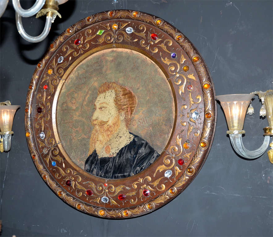 19th century oval portrait in tapestry and embroidery, silk velvet and lace, signed by G. Savoure. Sculpted and gilded wood frame, with Bohemian crystal colored cabochons.