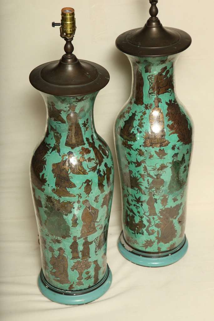 Pair of very unusual and tall, antique Chinese export  reverse  painted glass vases: each of elongated baluster forms, and each with very elaborate gilt figural designs on turquoise grounds, 19th Century
Stock Number: L21