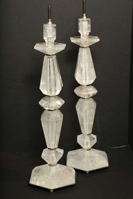 A very fine quality pair of art deco style rock crystal lamps with silver gilt wood bases. Overall height measures 34 inches.
Stock Number: L412