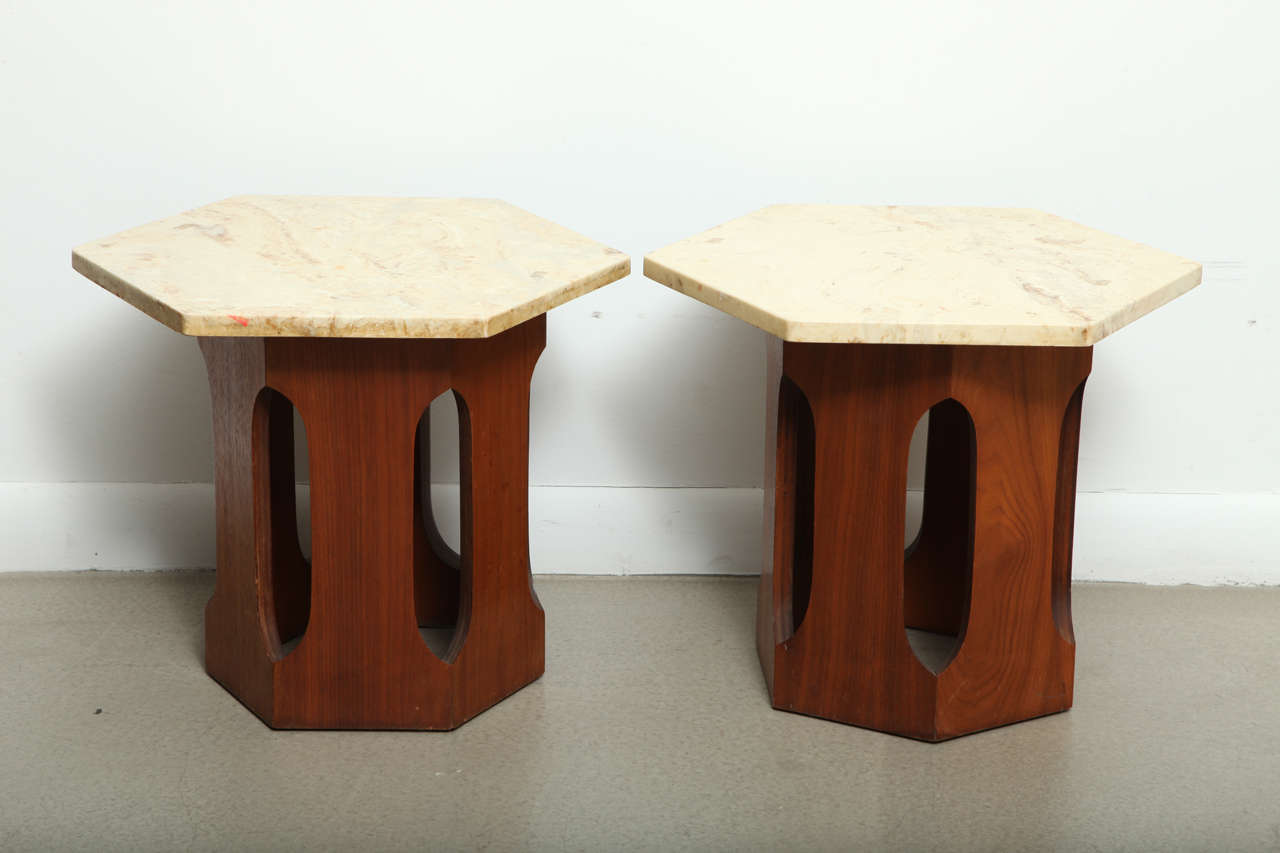 Pair of end tables with a hexagonal terrazzo top and pierced walnut base by Harvey Probber.  USA, circa 1950.