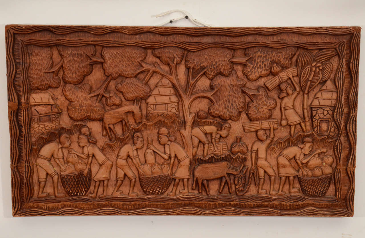 A magnificent  mahogany African village hand carved wall panel