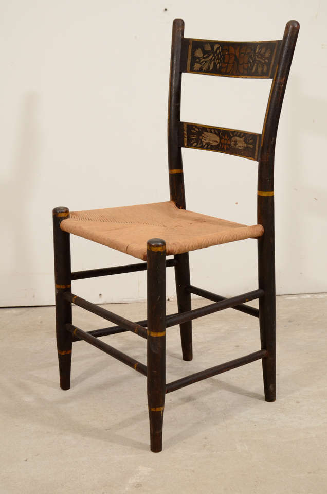 A set of six american stenciled and painted rush seated Hitchcock style side chairs 19th century.