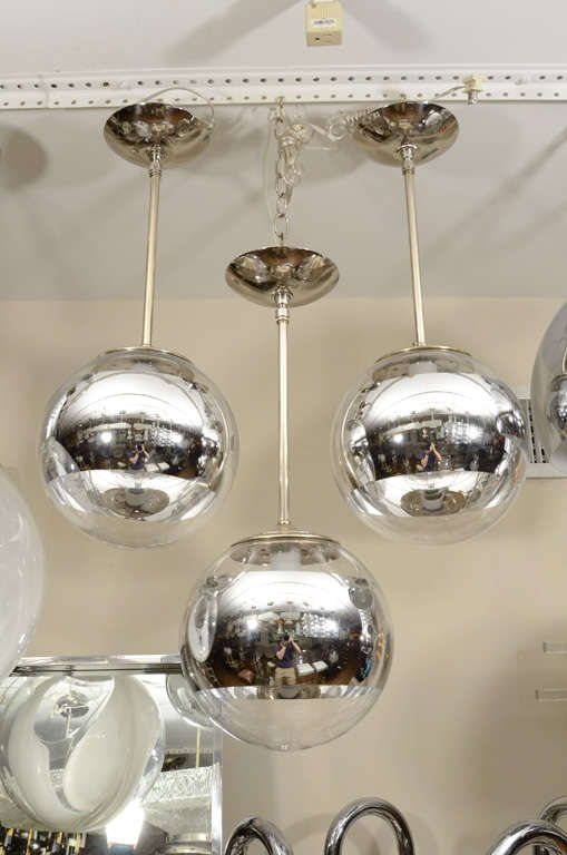 Nickel pendant ceiling fixture with clear spherical shade and mercury stripe detail.