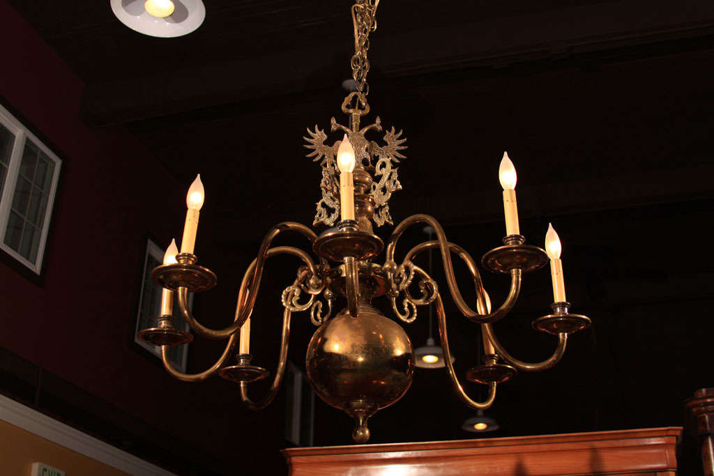 Dutch Brass Double Eagle Chandelier with Eight arms.<br />
<br />
This chandelier was very common to find about 20 years ago but has become harder to find in recent years.<br />
<br />
These came in single or double tiers traditionally and this